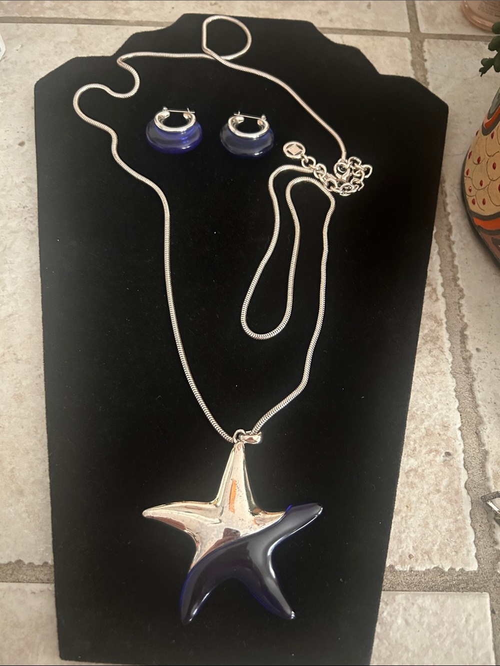 GIVENCHY Deep Blue Starfish Pendant Necklace with Matching Hoop Earrings.